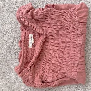 Soft stretchy flowy over the should cropped blouse.